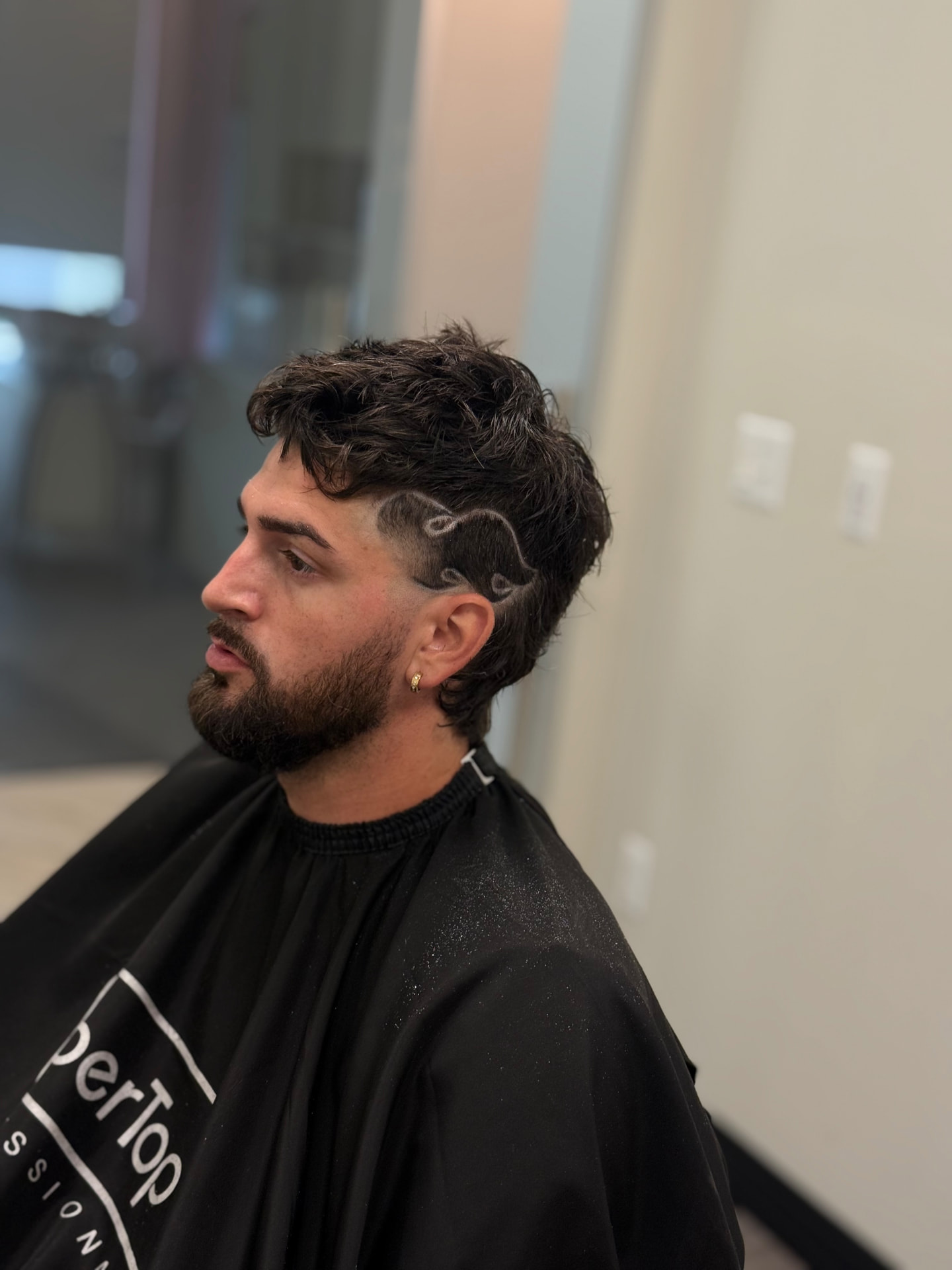 Mullet with freestyle line design and fade